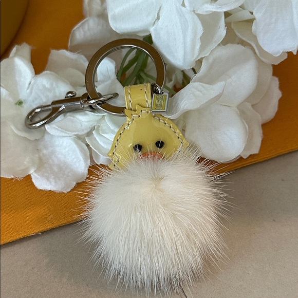 Coach Accessories - Coach Yellow and White Pom Pom Keychain